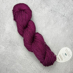 A skein of Symfonie Luna yarn on a grey surface. (Brand Name: Knit Pro)