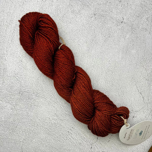 A skein of Symfonie Luna yarn by Knit Pro on a white surface.