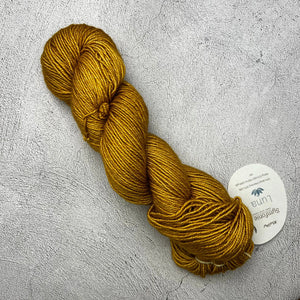 A skein of Symfonie Luna yarn on a grey surface. (Brand: Knit Pro)