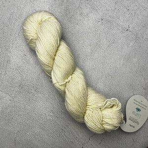 A skein of Symfonie Luna yarn with a Knit Pro tag on it.